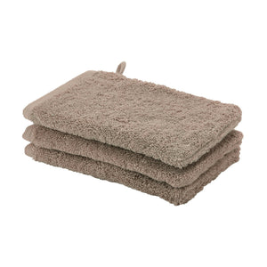 Stapel washandjes in zacht bruine kleur Aquanova London washandjes set in kleur Bronze